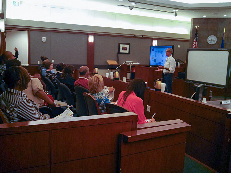 Chief Justice Douglas Herndon speaks in a courtroom