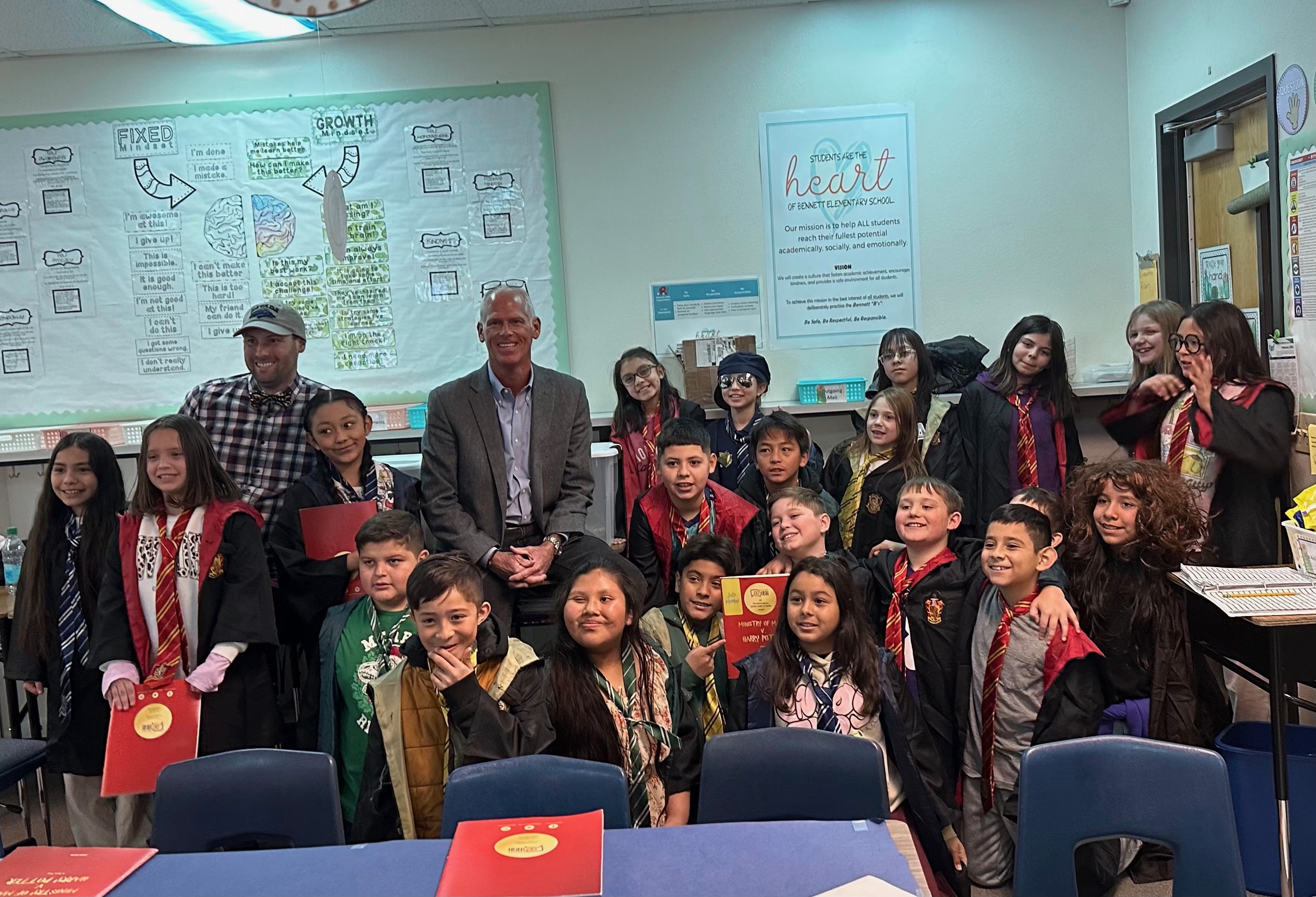 Chief Justice Douglas Herndon poses with a class of children